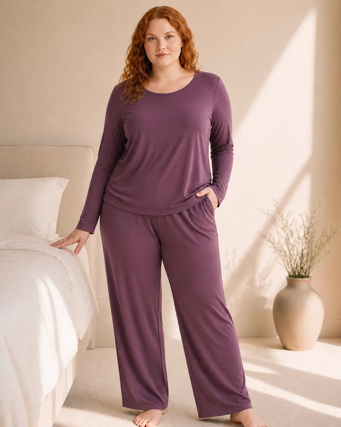 The Night Edit Long Sleeve Set in Dusty Plum, styled in a softly lit bedroom